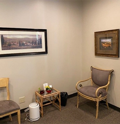 Counseling Office Waiting Area with Chairs and Framed Art on Walls